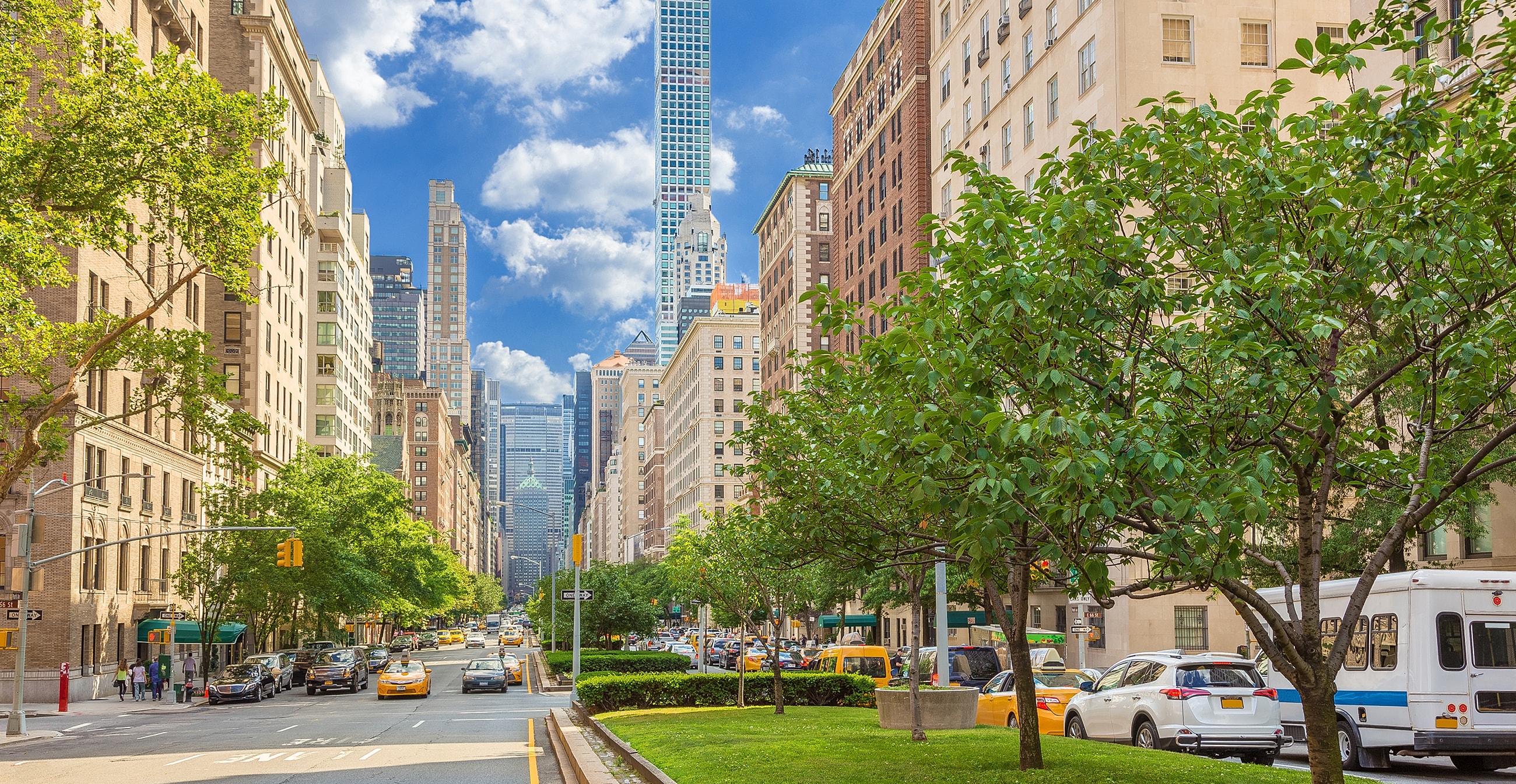 New York City street view with skyscrapers and trees, near NYC minimally invasive surgery.